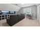 A living room featuring a dark couch and a TV at 2028 Ruddy Rd, Raleigh, NC 27616