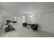 Finished basement with mirrored wall, exercise equipment and comfy seating area at 205 Glenview Pl, Chapel Hill, NC 27514