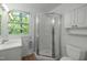 Bathroom featuring a vanity, shower stall and a window with lots of natural light at 205 Glenview Pl, Chapel Hill, NC 27514
