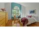 Bedroom with hardwood flooring, a vaulted ceiling and a built in desk at 205 Glenview Pl, Chapel Hill, NC 27514