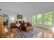 Bright bedroom with hardwood floors, large windows and a sitting area at 205 Glenview Pl, Chapel Hill, NC 27514
