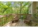 Outdoor deck perfect for relaxing with two chairs and a small table at 205 Glenview Pl, Chapel Hill, NC 27514