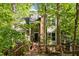 Charming home featuring a brick facade, two-story layout, and a welcoming front porch, surrounded by lush greenery at 205 Glenview Pl, Chapel Hill, NC 27514