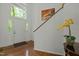 Bright foyer with white door, sidelights, transom window and hardwood flooring at 205 Glenview Pl, Chapel Hill, NC 27514
