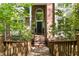 Inviting brick front entrance featuring an arched window and a well-maintained walkway at 205 Glenview Pl, Chapel Hill, NC 27514
