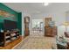 Cozy living room featuring hardwood floors, a classic rug, and stylish vintage furniture at 205 Glenview Pl, Chapel Hill, NC 27514