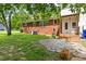 View of the backyard featuring a grassy lawn, patio, and partial view of the home at 209 N Occoneechee St, Hillsborough, NC 27278