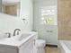 Bathroom showcasing a modern vanity, toilet, and a tiled shower/tub combination at 209 N Occoneechee St, Hillsborough, NC 27278