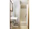 Bathroom featuring a shower, shelving and a vintage mirror at 209 N Occoneechee St, Hillsborough, NC 27278