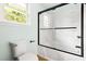 Bathroom showcasing a shower-tub combo with a glass enclosure at 209 N Occoneechee St, Hillsborough, NC 27278