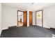 Bedroom features soft carpet, closet storage, and lots of light at 209 N Occoneechee St, Hillsborough, NC 27278