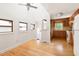 Bright dining room with hardwood floors, white walls, and a partial view of the kitchen at 209 N Occoneechee St, Hillsborough, NC 27278
