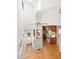 Open kitchen with a fan, featuring wooden cabinets and white appliances at 209 N Occoneechee St, Hillsborough, NC 27278
