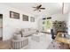 Bright living area with a modern design, fan, desk and light color palette at 209 N Occoneechee St, Hillsborough, NC 27278