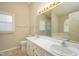 Bathroom with dual sinks, framed mirror and window at 210 Needle Park Dr, Cary, NC 27513