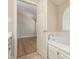 Bright bathroom features a soaking tub with window and neutral tile at 210 Needle Park Dr, Cary, NC 27513