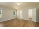 Bright primary bedroom features a vaulted ceiling and hardwood floors at 210 Needle Park Dr, Cary, NC 27513
