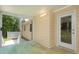 Cozy sunroom featuring access to backyard and an entry door at 210 Needle Park Dr, Cary, NC 27513