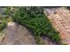 This aerial shows an area with wooded and cleared land, and new home construction at 2102 Courtland Dr, Sanford, NC 27330