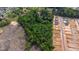 This aerial shows an area with wooded and cleared land, and new home construction at 2102 Courtland Dr, Sanford, NC 27330