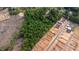 This aerial shows an area with wooded and cleared land, and new home construction at 2102 Courtland Dr, Sanford, NC 27330