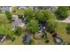 Lushly landscaped property, home featuring a fenced backyard and pool area at 2102 Courtland Dr, Sanford, NC 27330