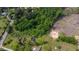 Aerial view of a lot that is partially cleared with some surrounding homes at 2102 Courtland Dr, Sanford, NC 27330