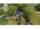 Home aerial view featuring a fenced backyard, shed, and mature landscaping at 2102 Courtland Dr, Sanford, NC 27330