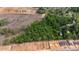 This aerial shows an area with wooded and cleared land, and new home construction at 2102 Courtland Dr, Sanford, NC 27330