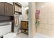 Well-lit bathroom showcasing a vanity, shower, and tiled floors at 2102 Courtland Dr, Sanford, NC 27330