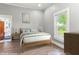 Bedroom featuring a window for natural light, hardwood floors and neutral toned decor at 2102 Courtland Dr, Sanford, NC 27330