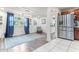 Well-lit dining area with stainless steel fridge and hardwood floors at 2102 Courtland Dr, Sanford, NC 27330