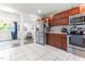 Open concept kitchen with stainless steel appliances and views of the adjacent living area at 2102 Courtland Dr, Sanford, NC 27330