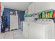 Functional laundry room with washer, dryer, and ample cabinet storage at 2102 Courtland Dr, Sanford, NC 27330