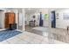 Bright living area featuring tile and hardwood flooring, with an attached kitchen at 2102 Courtland Dr, Sanford, NC 27330