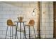 Chic bar area with barstool seating, a round table, and a modern standing lamp at 220 Glenhill Ln, Chapel Hill, NC 27514