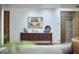 Modern basement with dark wood console, record player, and vintage artwork adding character to the space at 220 Glenhill Ln, Chapel Hill, NC 27514