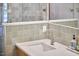 Close up of modern bathroom vanity with square tiled shower in background at 220 Glenhill Ln, Chapel Hill, NC 27514
