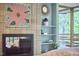 Closeup of tiled fireplace in bedroom with view of deck at 220 Glenhill Ln, Chapel Hill, NC 27514