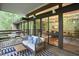 Outdoor deck with seating, bright rug and views into the home at 220 Glenhill Ln, Chapel Hill, NC 27514