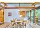 Open floor plan with dining area featuring modern furniture and natural light at 220 Glenhill Ln, Chapel Hill, NC 27514