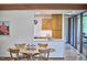 Dining area and kitchen with modern cabinets, countertops and recessed lighting at 220 Glenhill Ln, Chapel Hill, NC 27514