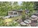 Modern home with attractive landscaping, beautiful stonework, and an inviting front entrance at 220 Glenhill Ln, Chapel Hill, NC 27514