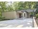 Modern house with a flat roof, covered parking and driveway leading to the front entrance at 220 Glenhill Ln, Chapel Hill, NC 27514