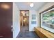 Inviting foyer with slate floors, modern art, built-in bench, and a view of the outdoors at 220 Glenhill Ln, Chapel Hill, NC 27514