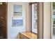 Light filled foyer with built-in bench, modern art, and views of the outdoor landscape at 220 Glenhill Ln, Chapel Hill, NC 27514