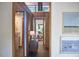 Hallway featuring an art display, clerestory window, and a view into other rooms at 220 Glenhill Ln, Chapel Hill, NC 27514