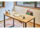 View of a home office with a sleek desk, stylish chair, and a bright window at 220 Glenhill Ln, Chapel Hill, NC 27514