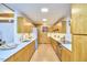 Spacious kitchen with modern appliances, natural wood cabinets, and ample counter space at 220 Glenhill Ln, Chapel Hill, NC 27514