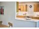This kitchen has premium stainless steel appliances, quartz countertops and light wood cabinets at 220 Glenhill Ln, Chapel Hill, NC 27514